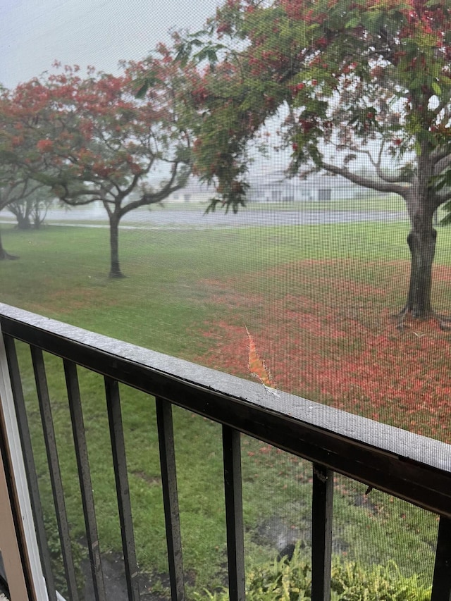 view of yard featuring a balcony