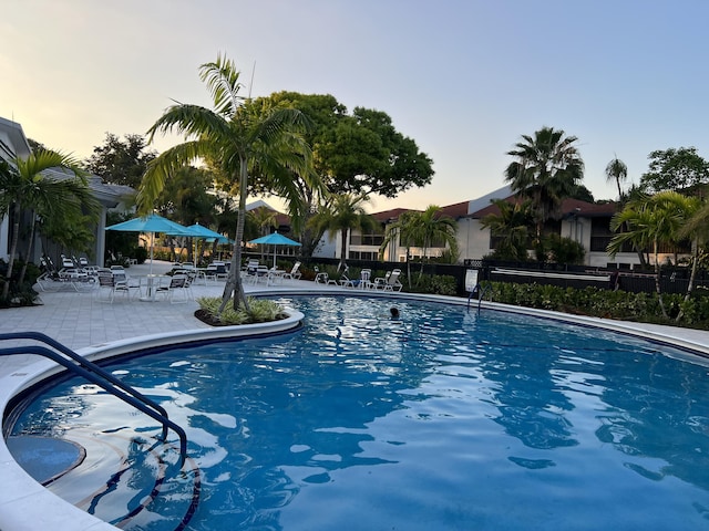 community pool with a patio area