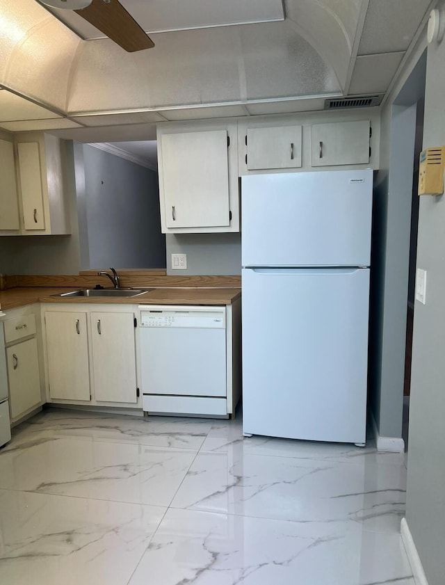 kitchen with marble finish floor, visible vents, a ceiling fan, a sink, and white appliances