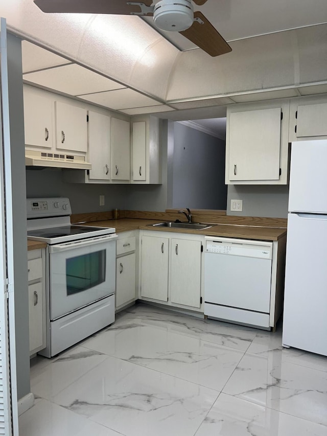 kitchen featuring marble finish floor, a ceiling fan, a sink, white appliances, and under cabinet range hood