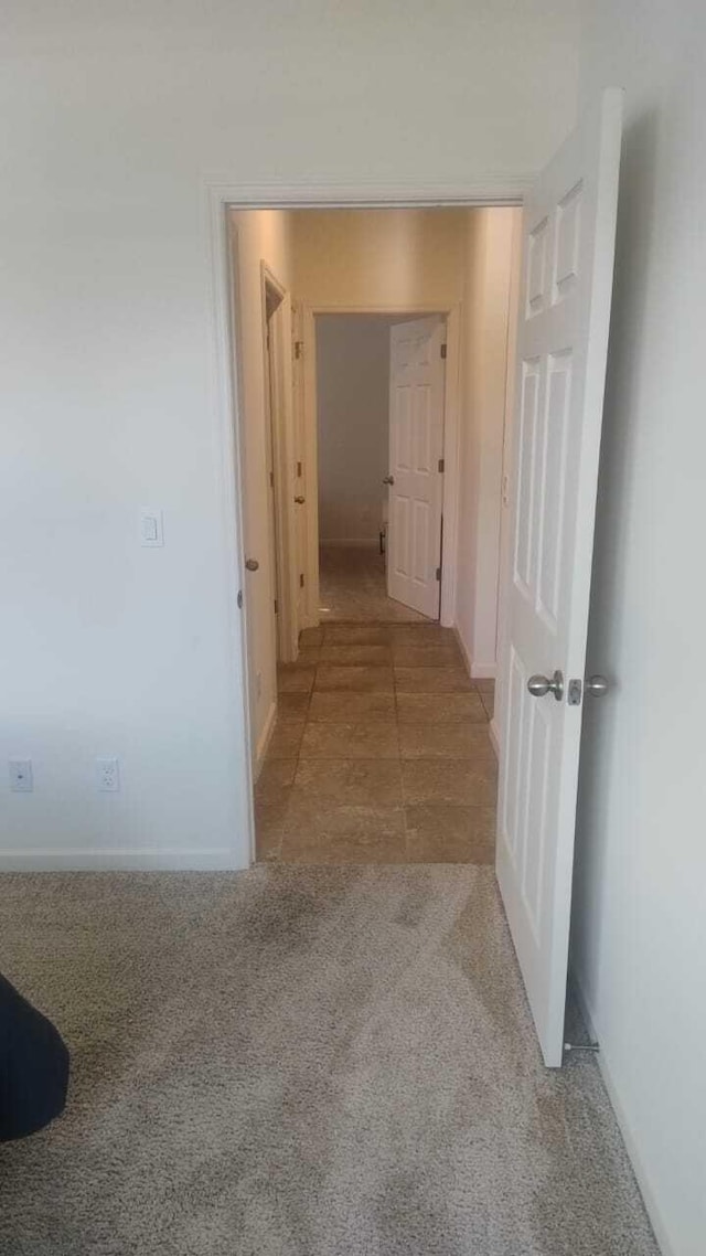 6259 NW Regent St, Port Saint Lucie, FL 34983 - hallway with carpet flooring and baseboards