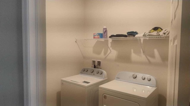 6259 NW Regent St, Port Saint Lucie, FL 34983 - laundry area with laundry area and washer and clothes dryer