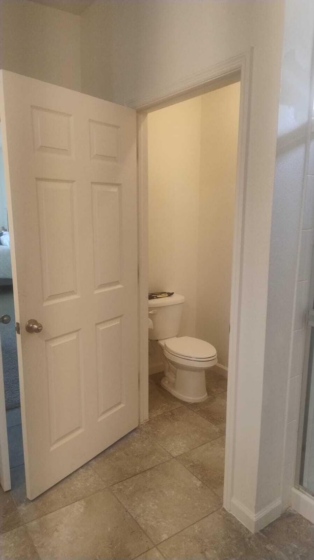 6259 NW Regent St, Port Saint Lucie, FL 34983 - bathroom featuring toilet