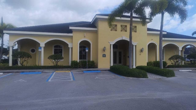 6259 NW Regent St, Port Saint Lucie, FL 34983 - view of building exterior with uncovered parking
