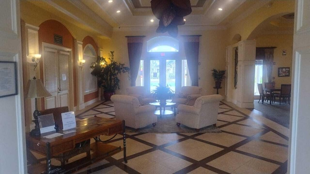 6259 NW Regent St, Port Saint Lucie, FL 34983 - living area with crown molding, arched walkways, and recessed lighting