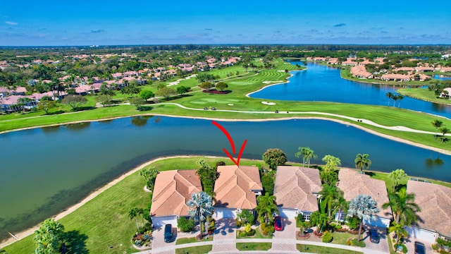 aerial view featuring a water view and golf course view