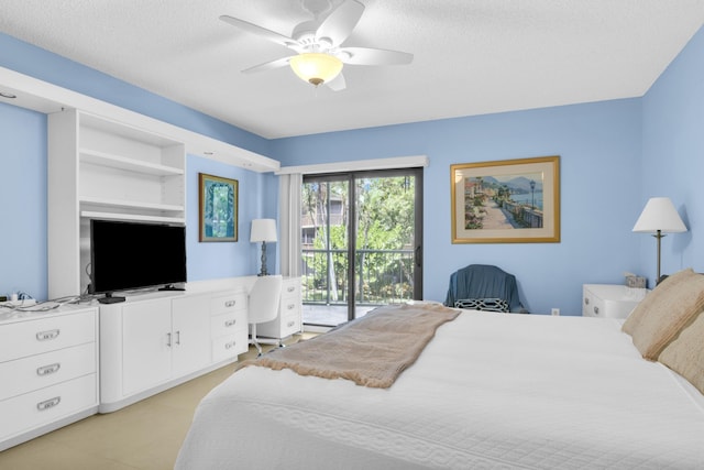 bedroom featuring a textured ceiling, a baseboard heating unit, a ceiling fan, and access to exterior