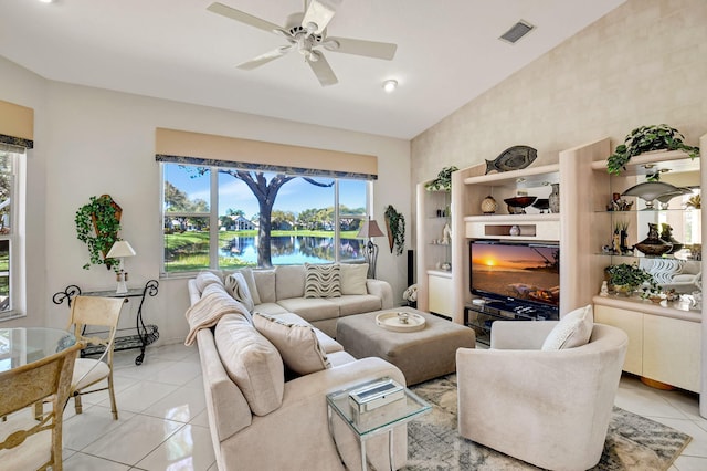 living room with high vaulted ceiling, visible vents, ceiling fan, and light tile patterned floors