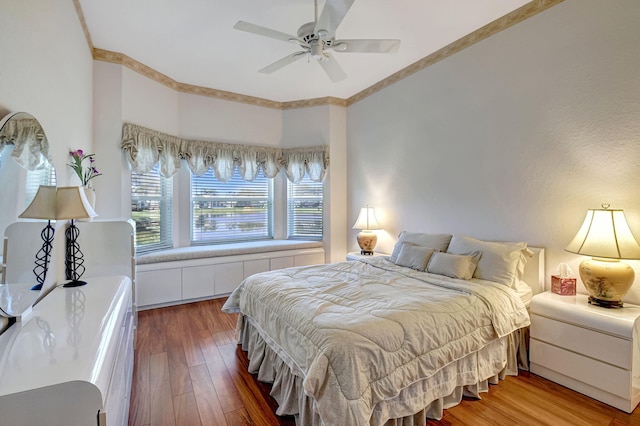 bedroom with a ceiling fan and wood finished floors