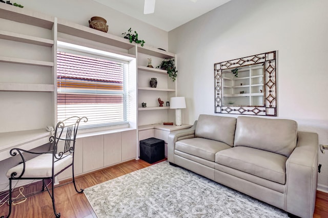 living room with a ceiling fan and wood finished floors