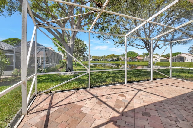 unfurnished sunroom with a water view