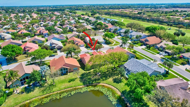 bird's eye view featuring a water view and a residential view