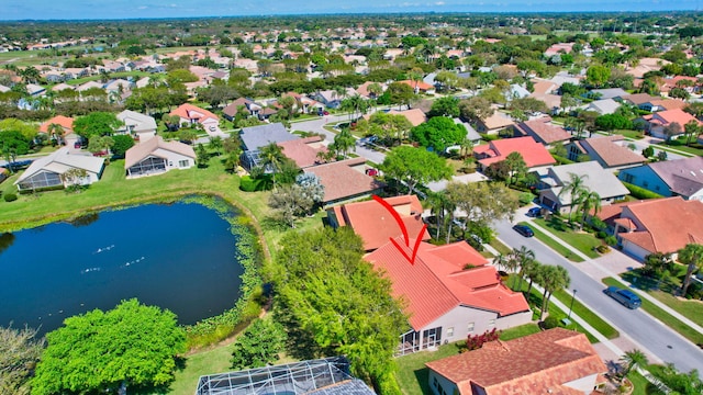 aerial view with a residential view and a water view