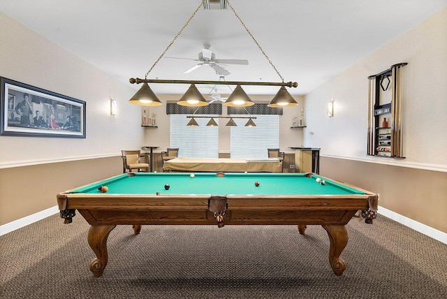 recreation room featuring a ceiling fan, visible vents, carpet floors, and baseboards