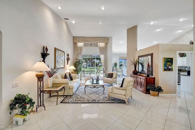 living area featuring light tile patterned floors, baseboards, visible vents, vaulted ceiling, and recessed lighting