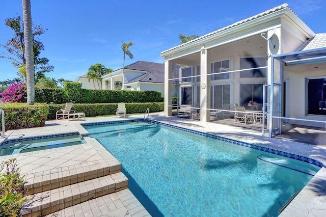 view of swimming pool with a patio, a fenced in pool, fence, and a sunroom