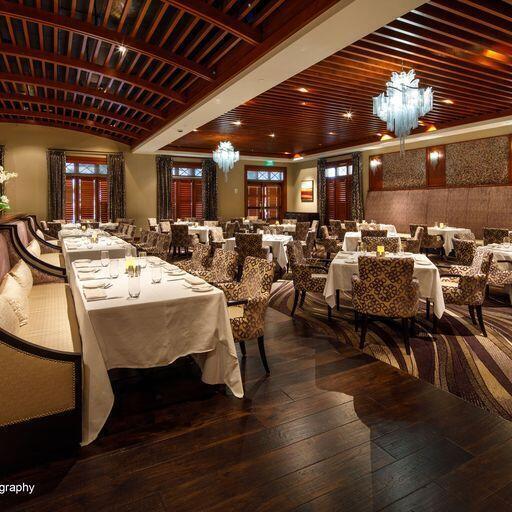 dining space with an inviting chandelier and hardwood / wood-style floors