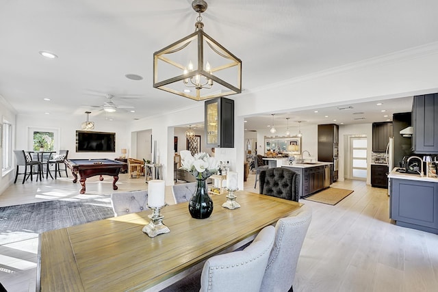 dining space featuring crown molding, pool table, and a healthy amount of sunlight