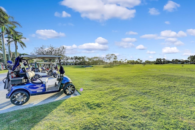 view of home's community featuring a carport and a lawn