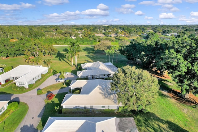 drone / aerial view featuring a forest view