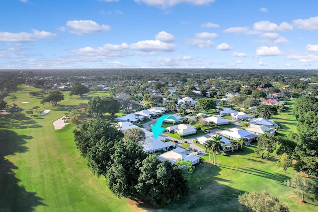 aerial view featuring view of golf course and a residential view