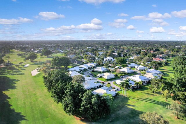 drone / aerial view featuring golf course view and a residential view