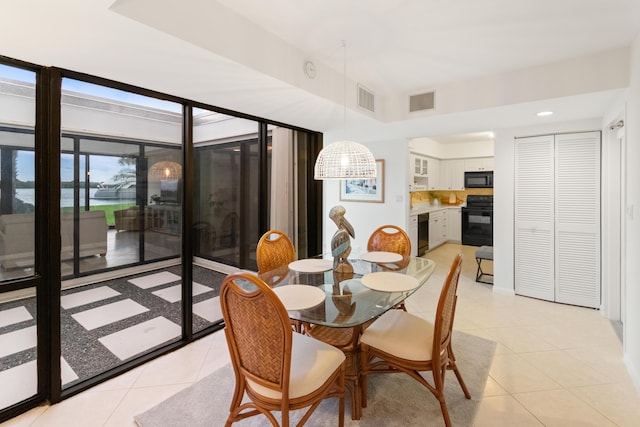 dining room with visible vents and light tile patterned floors