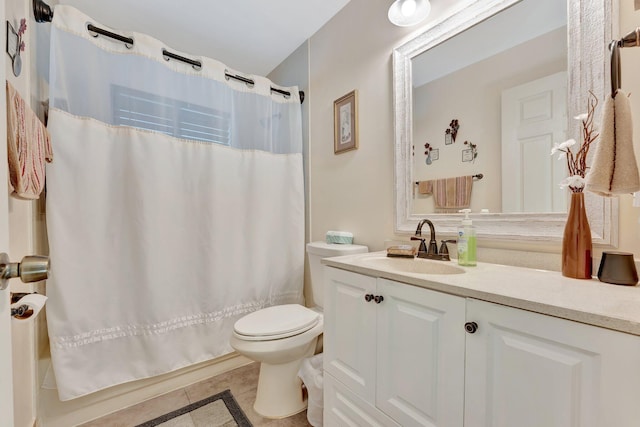 bathroom featuring shower / tub combo, tile patterned flooring, vanity, and toilet