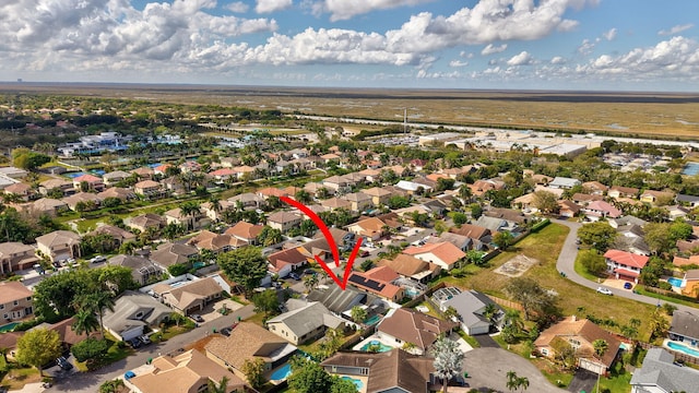 birds eye view of property with a residential view