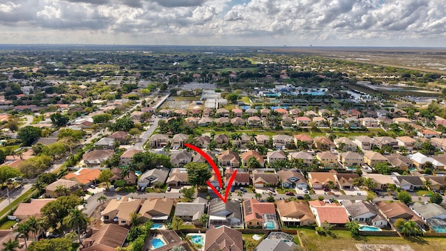 birds eye view of property with a residential view