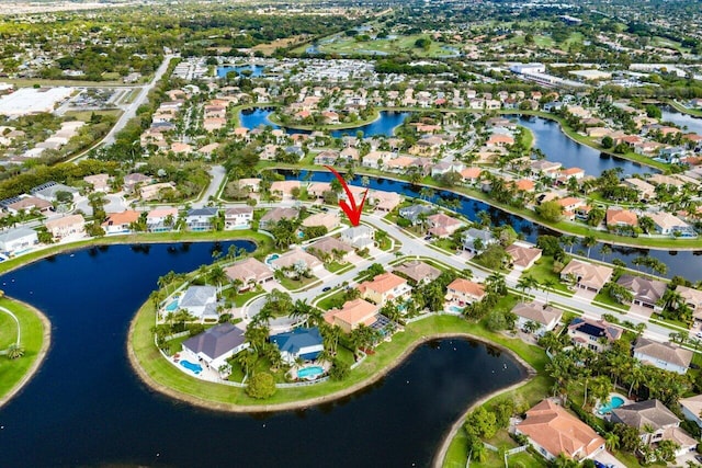 birds eye view of property featuring a residential view and a water view