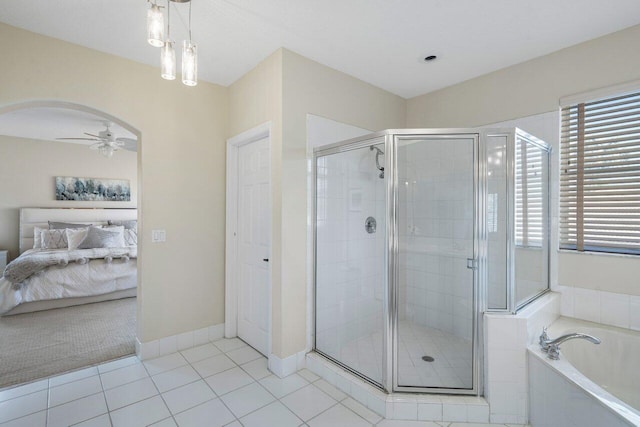 full bathroom with tile patterned flooring, a shower stall, ceiling fan, a garden tub, and ensuite bath