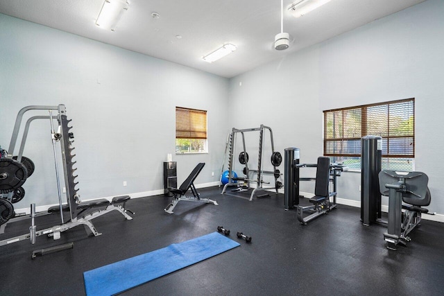 workout area featuring baseboards