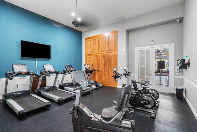 gym featuring french doors and baseboards