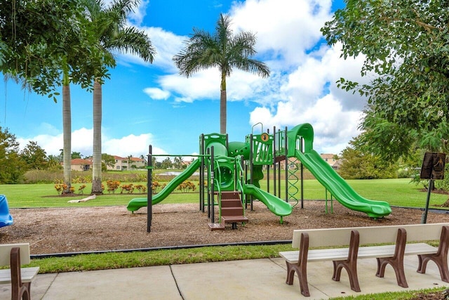 community playground featuring a lawn