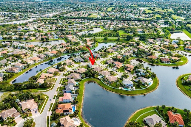 aerial view with a residential view and a water view