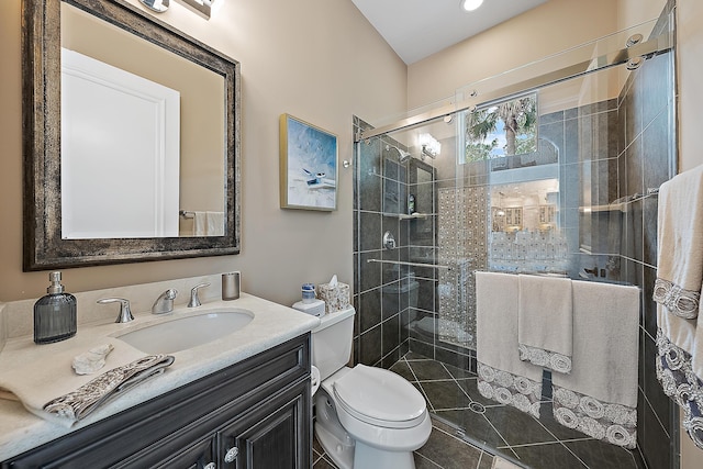 full bathroom featuring a stall shower, vanity, and toilet