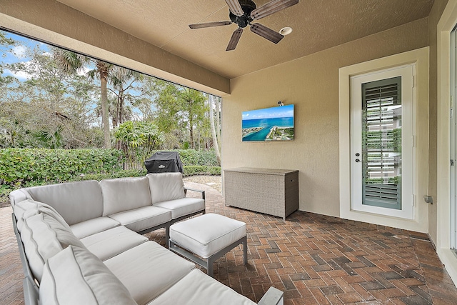 view of patio / terrace with ceiling fan and outdoor lounge area