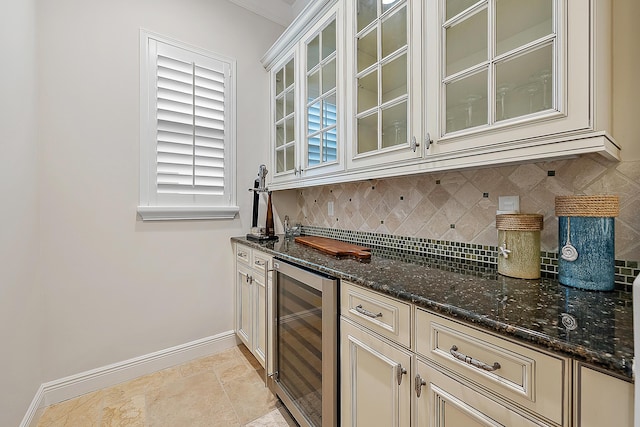 bar featuring wine cooler, baseboards, and decorative backsplash