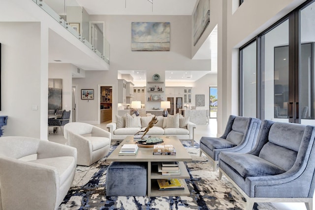 living room with a high ceiling