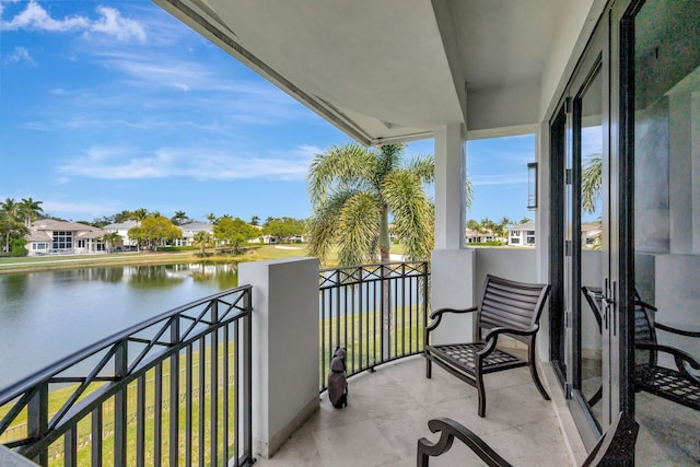 balcony featuring a water view