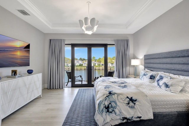 bedroom with visible vents, access to outside, a tray ceiling, crown molding, and french doors