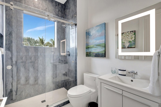 full bath featuring a shower stall, toilet, and vanity