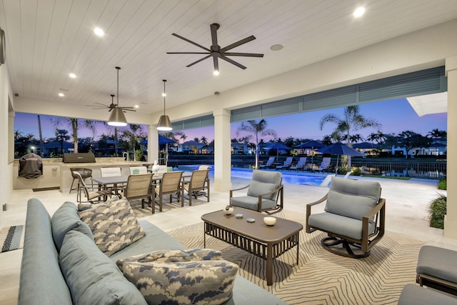 patio terrace at dusk featuring a fenced in pool, outdoor lounge area, a ceiling fan, a grill, and fence