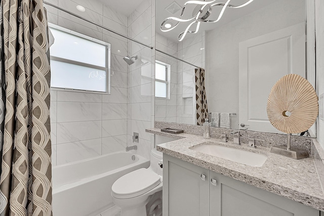 bathroom with toilet, shower / bath combo with shower curtain, and vanity