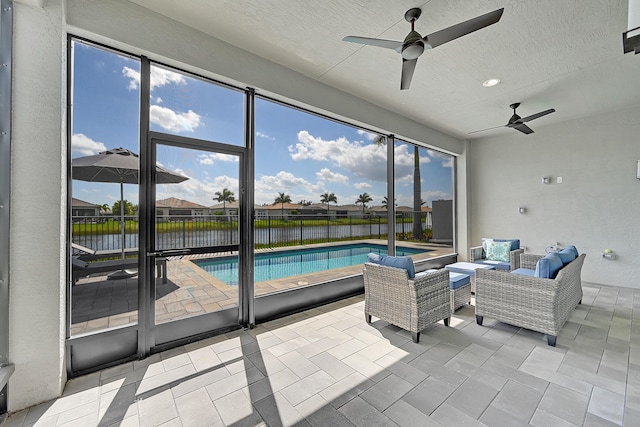 view of swimming pool featuring a ceiling fan