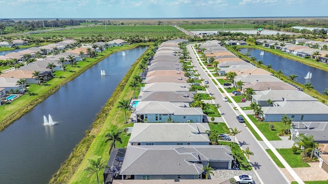 aerial view featuring a water view and a residential view