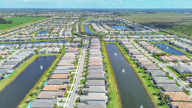 bird's eye view with a water view and a residential view