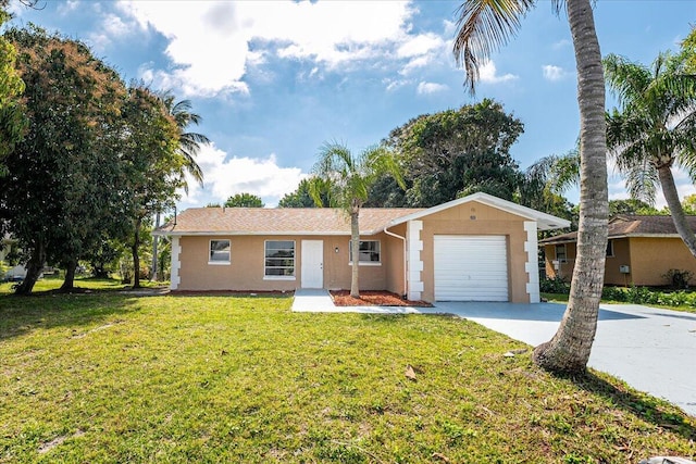 ranch-style house with a garage, concrete driveway, a front yard, and stucco siding