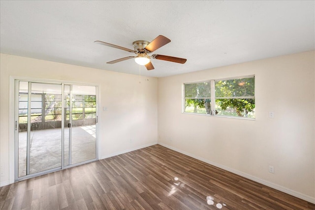 380 SE Crosspoint Dr, Port Saint Lucie, FL 34983 - unfurnished room with a ceiling fan, a wealth of natural light, baseboards, and wood finished floors